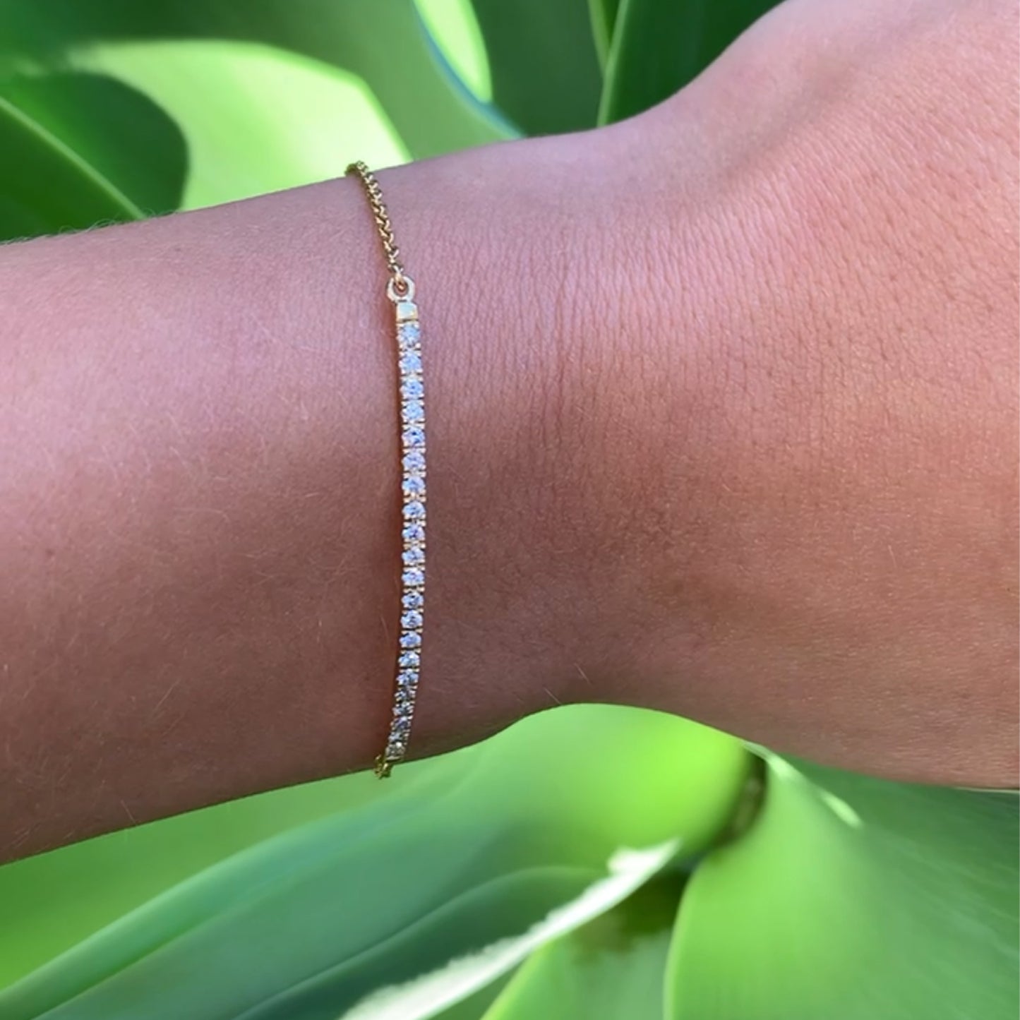9k Yellow gold lab diamond bracelet on model's arm