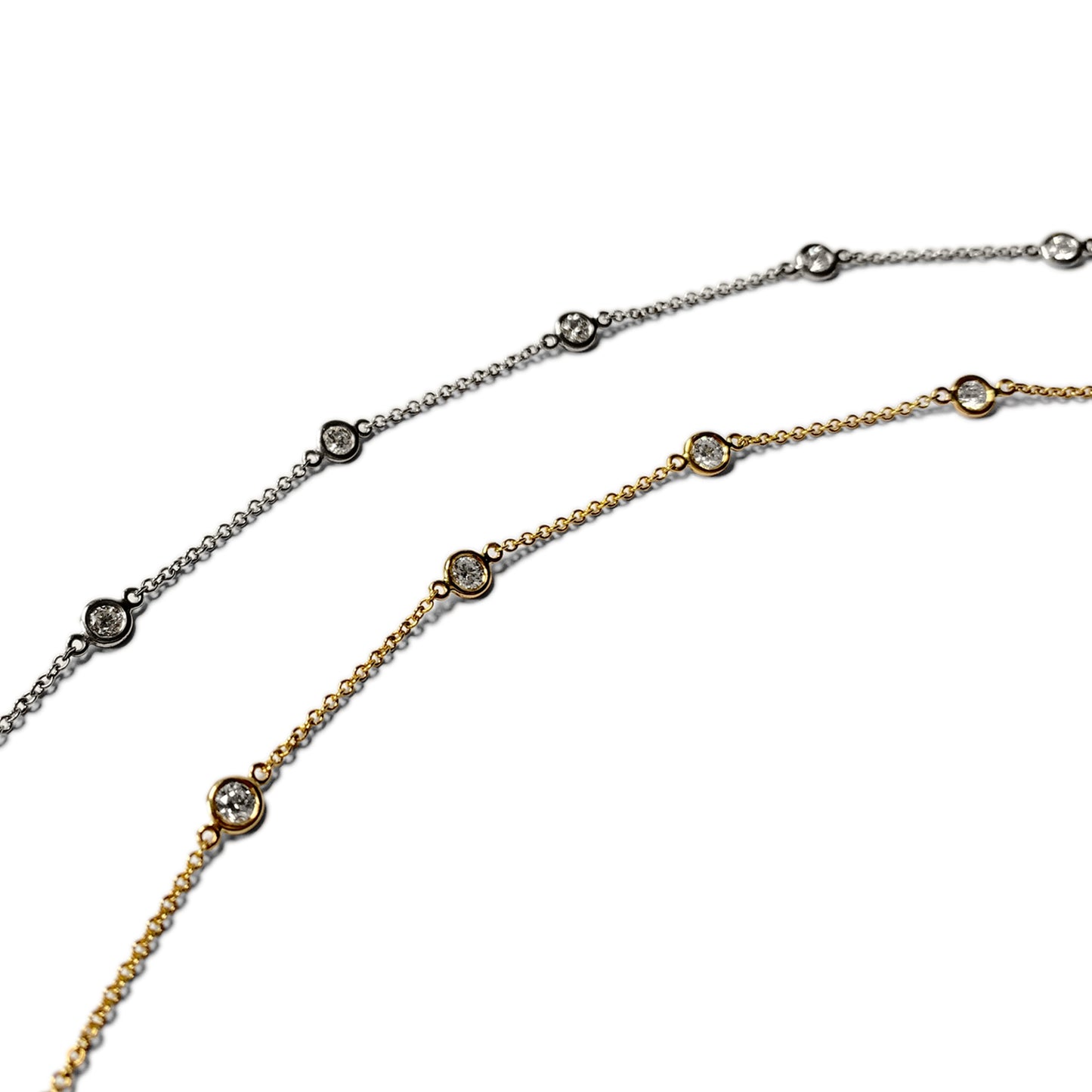 Diamonds by the yard bracelets in yellow and white gold with bezel set lab grown diamonds