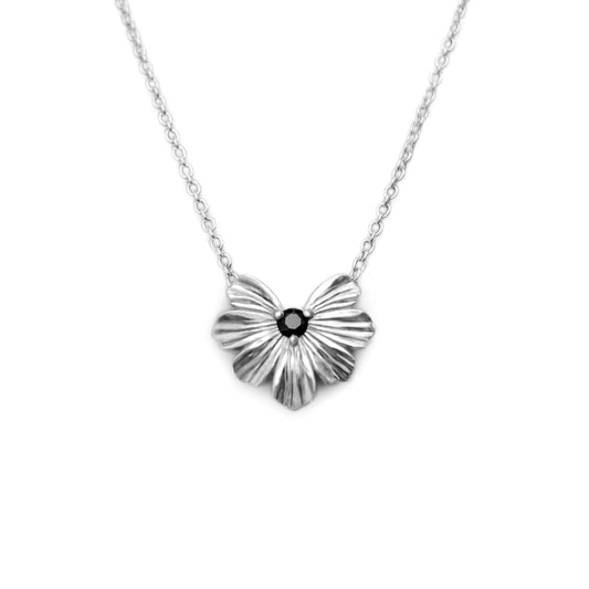 Silver floral heart shaped pendant with black moissanite on a rolo chain