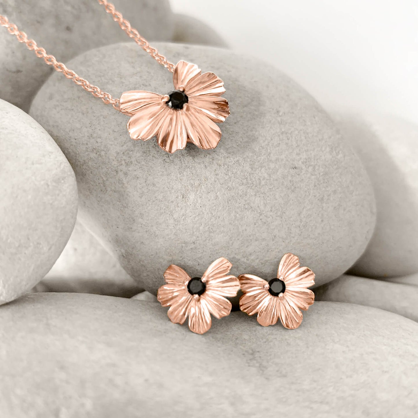Floral heart necklace and stud earrings in 9k rose gold with black moissanite.
