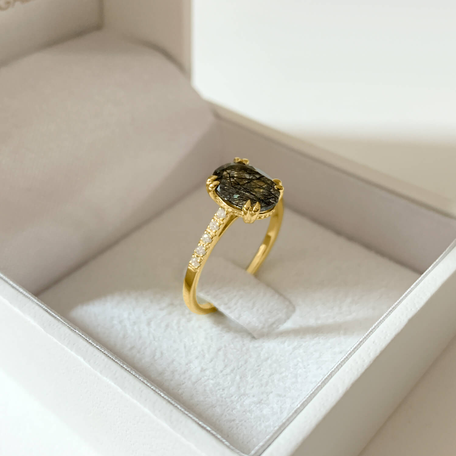 9k Yellow gold ring with oval Tourmalated quartz and moissanite