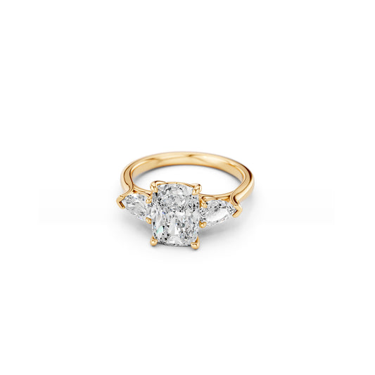 Yellow gold three-stone ring with cushion centre and pear-shaped side stones