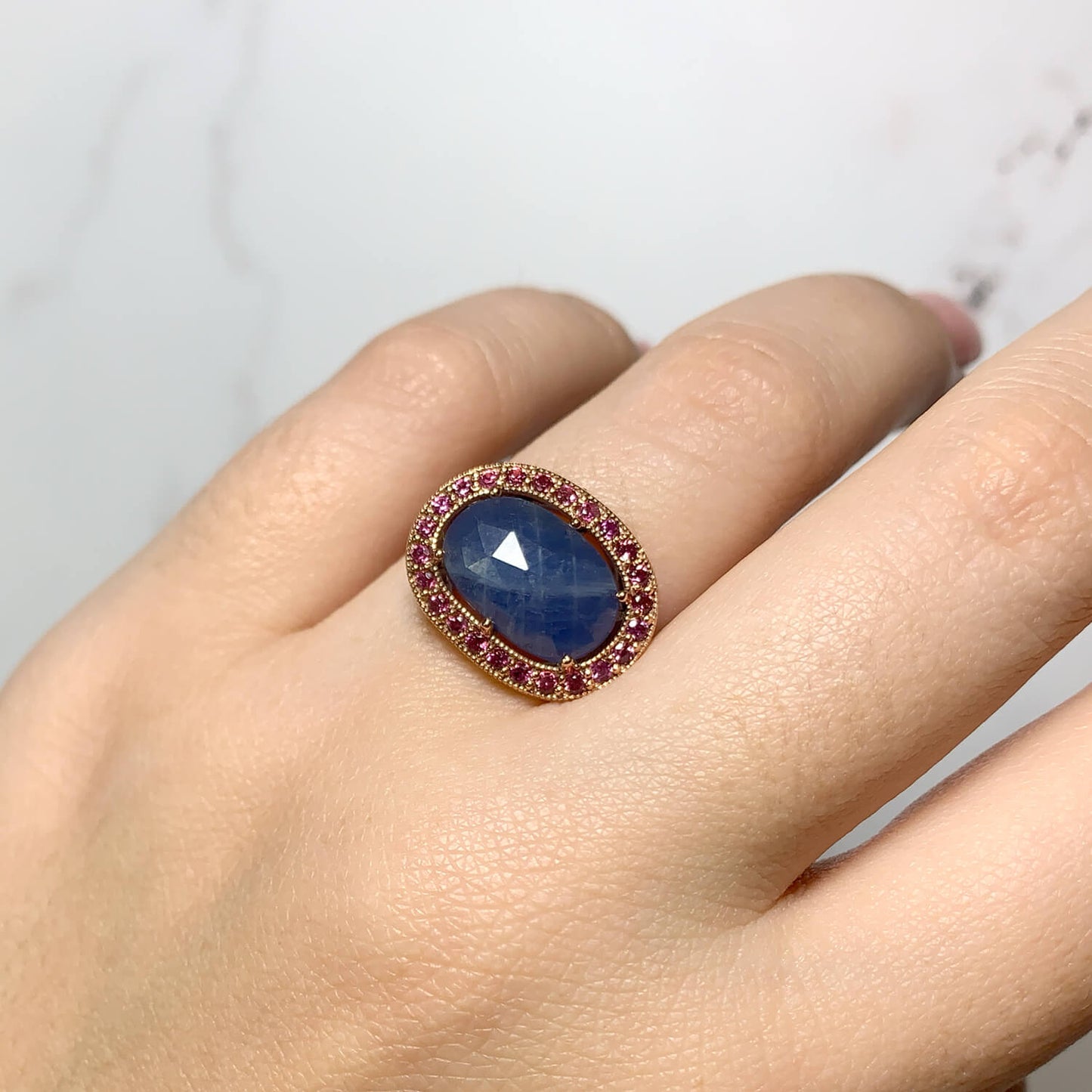 Dauntless ring in rose gold viewed on a hand