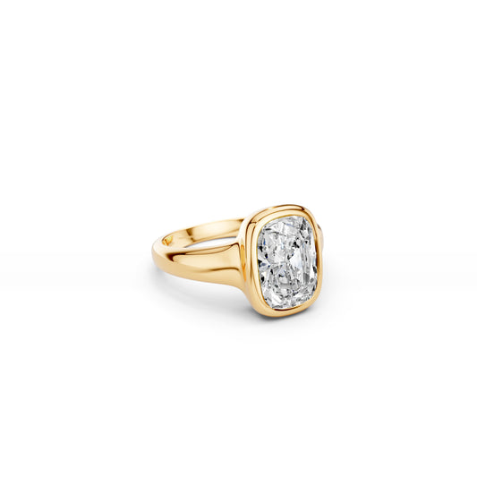 Chunky elongated cushion-cut ring with puffy gold silhouette in yellow gold
