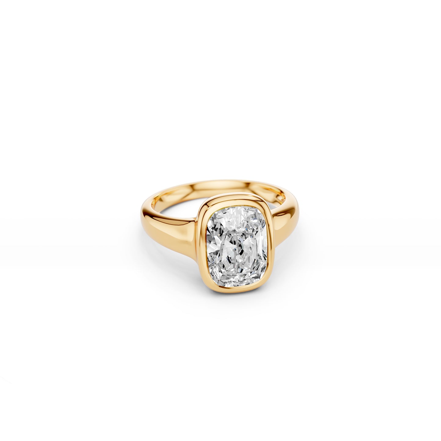 Elongated cushion-cut diamond ring with bold gold bezel, angled view 