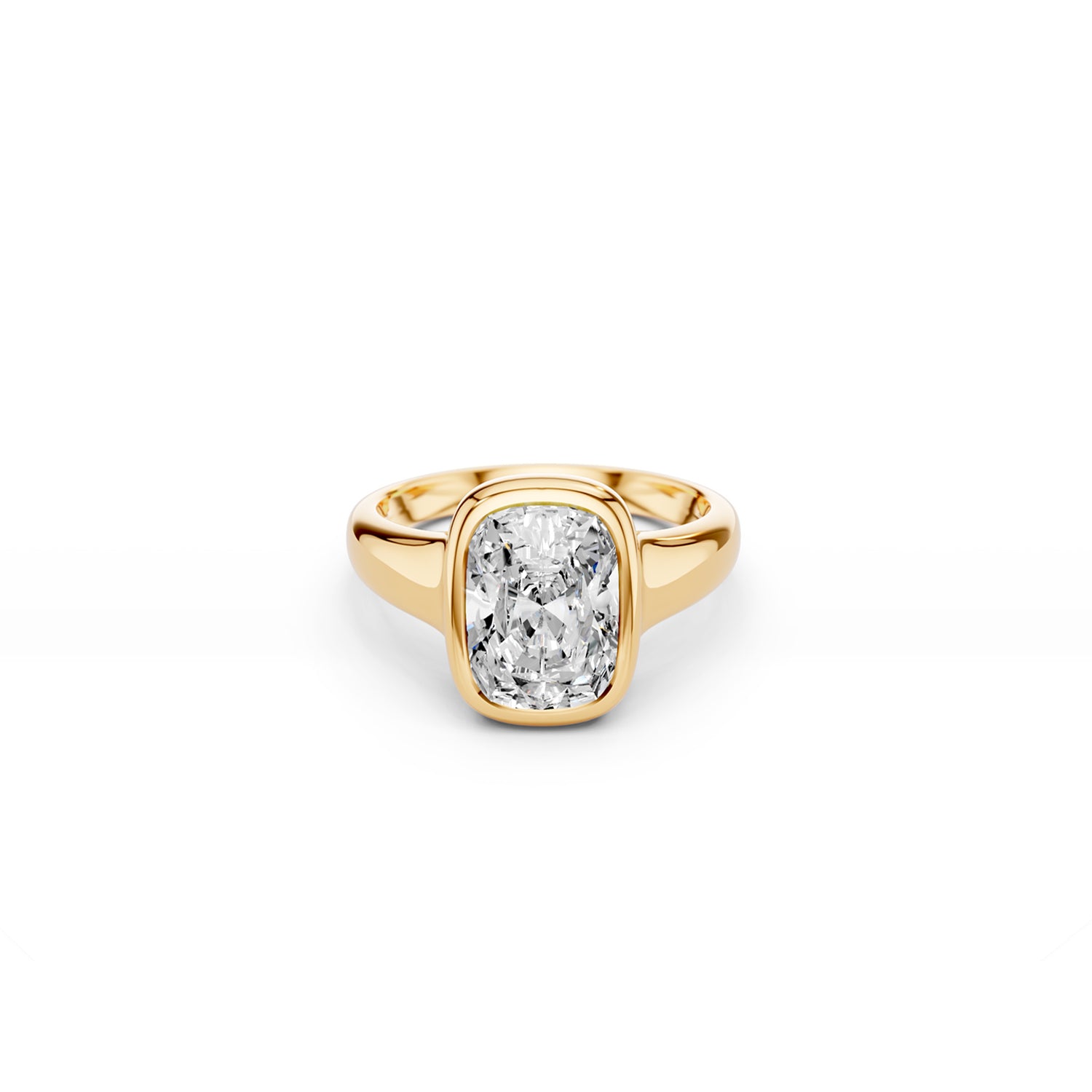 Bezel set elongated cushion-cut ring with puffy gold silhouette in yellow gold