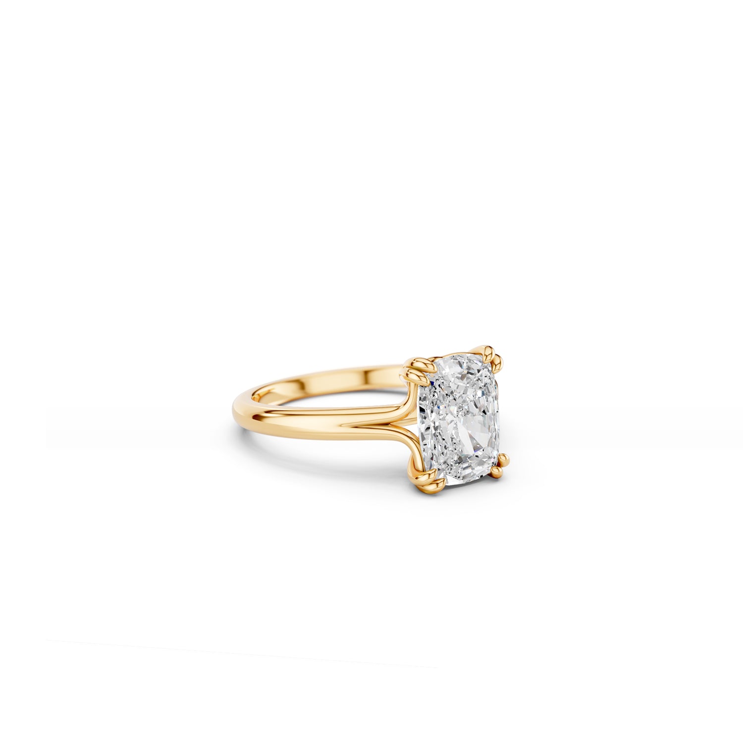 Cushion-cut solitaire engagement ring with double claws and split band in yellow gold