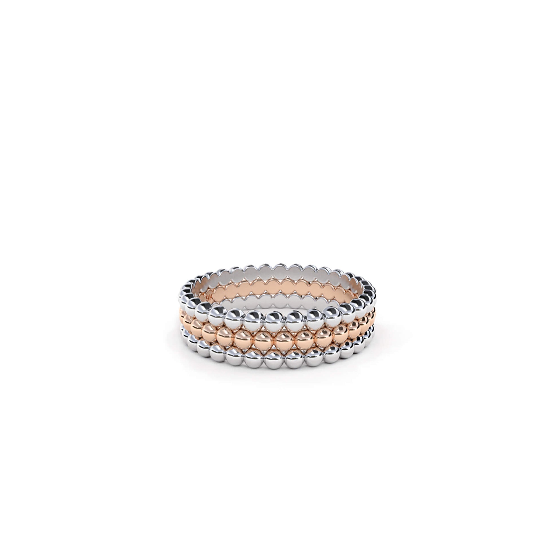 The Dotted Line Ring stack in 9k white and rose gold