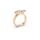 Detail of fluid crossover sides and  partial bezel on a marquise cut diamond statement ring in rose gold