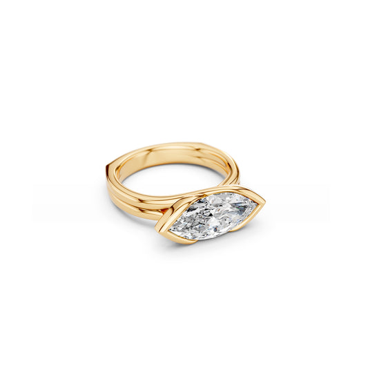Angled view of east west, partial bezel marquise statement ring with fluid curves and a euro shank 