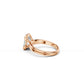 Perspective side view of engagement ring highlighting double band and open split bezel holding an emerald cut diamond 