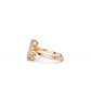 Side view of hexagon step-cut solitaire engagement ring in rose gold