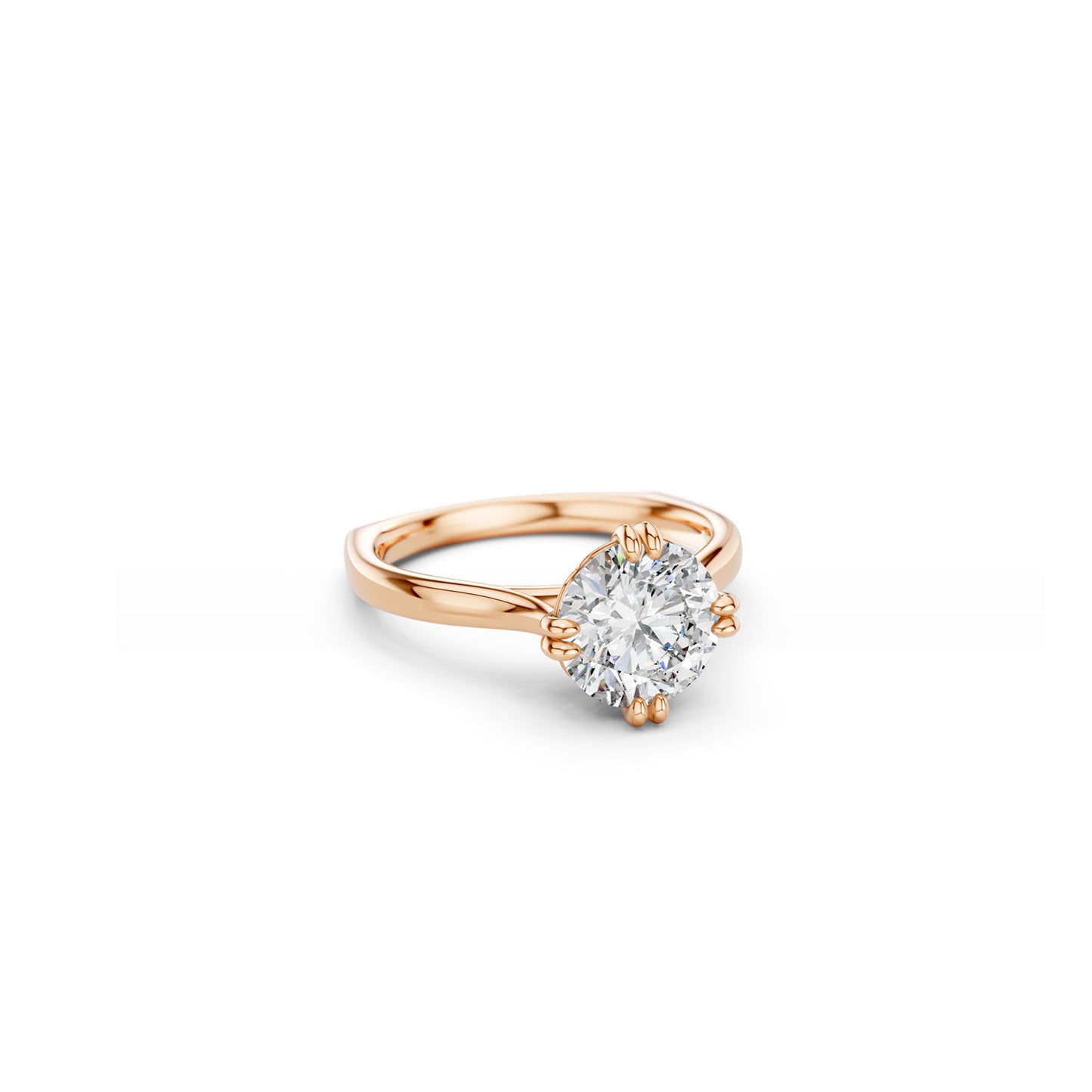 Angled top view of a classic rose gold round brilliant cut diamond solitaire with double compass set claws