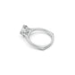 Perspective side view of a modern round diamond solitaire ring with hidden heart details, cathedral shoulders and a euro shank in white gold