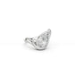 Angled view of pear-shaped diamond wave engagement ring in white gold