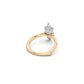 Two-tone marquise solitaire ring with a white gold petal-inspired setting on a yellow gold euro shank with cathedral shoulders
