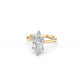 Two-tone marquise solitaire ring with white gold setting on a yellow gold band, viewed at a slight angle