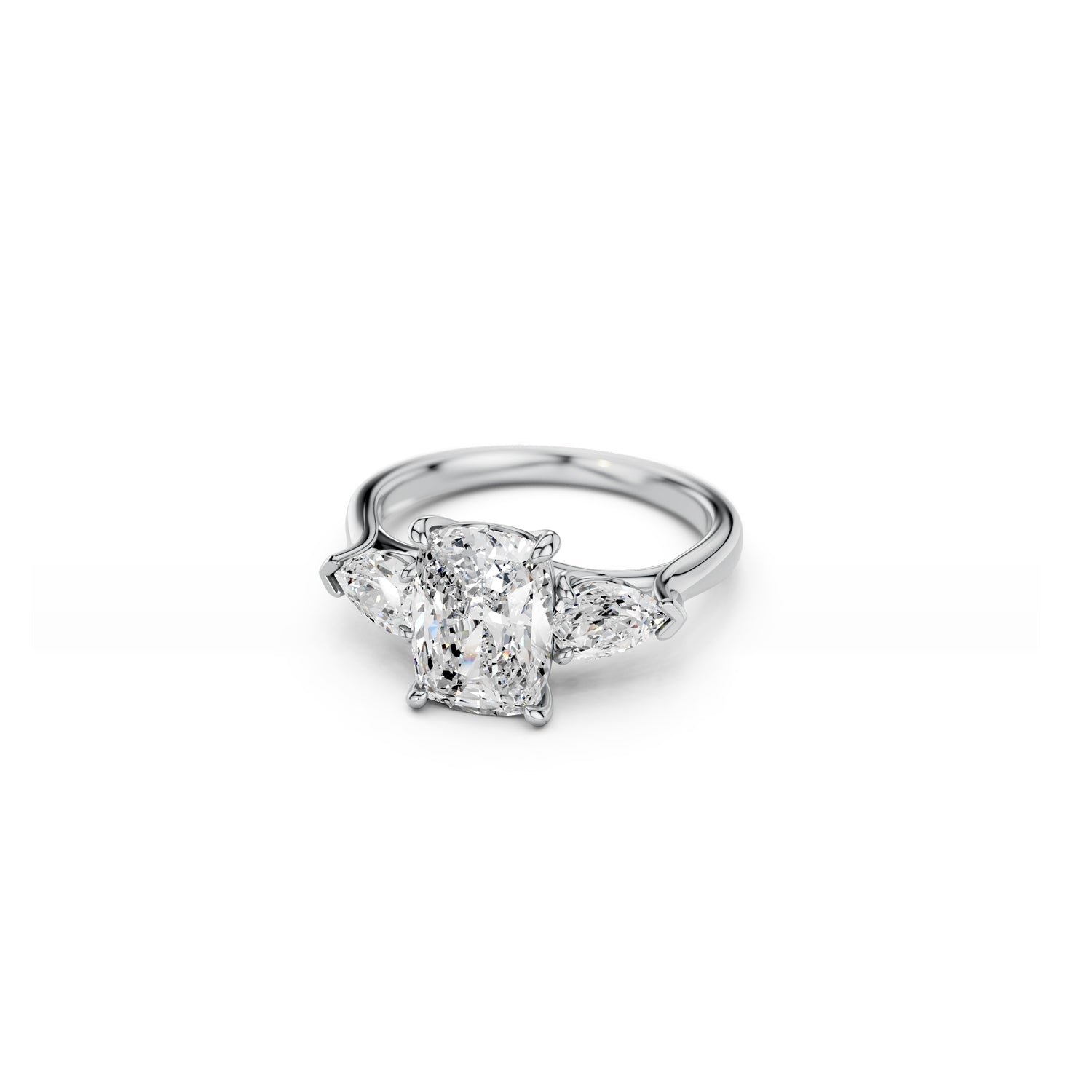 White gold cushion and pear diamond three-stone engagement ring