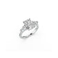 Perspective view of platinum cushion and pear diamond three-stone ring 
