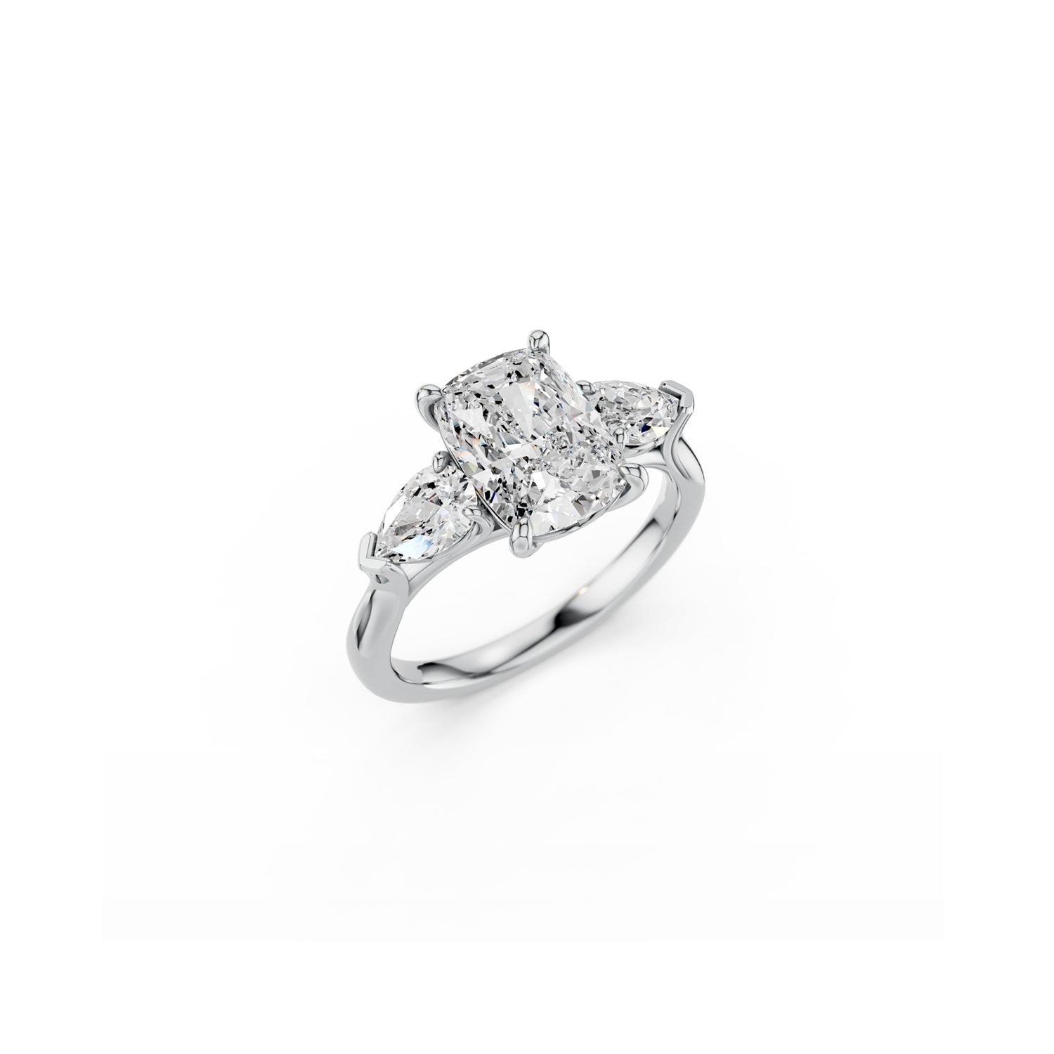 Perspective view of platinum cushion and pear diamond three-stone ring 