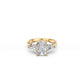 Three-stone engagement ring with cushion-cut centre and pear-shaped side stones, top view