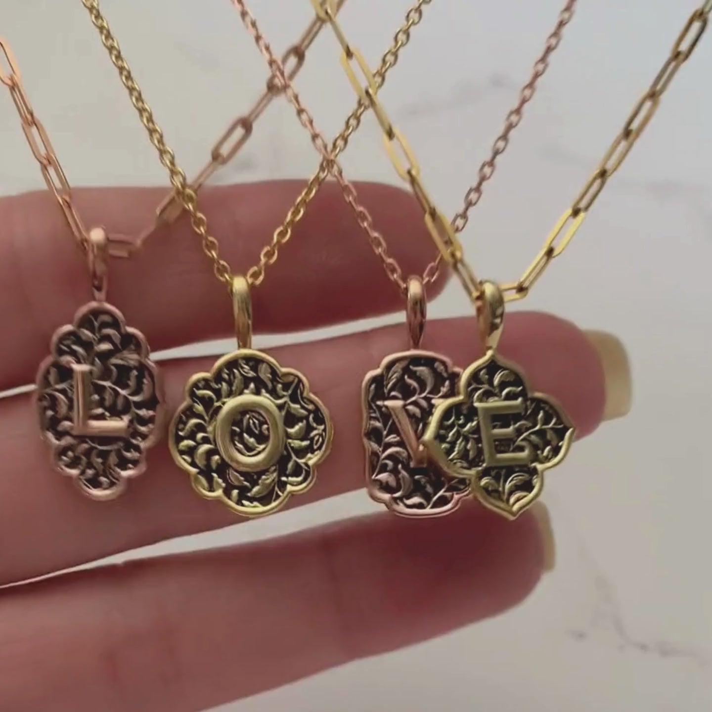 Video of all four love letter initial pendant shapes in gold